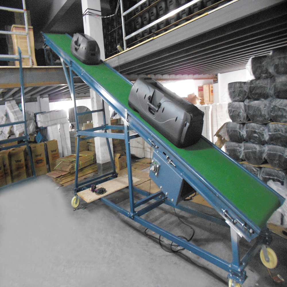 Adjustable height inclined belt conveyor for loading cartons to mezzanine